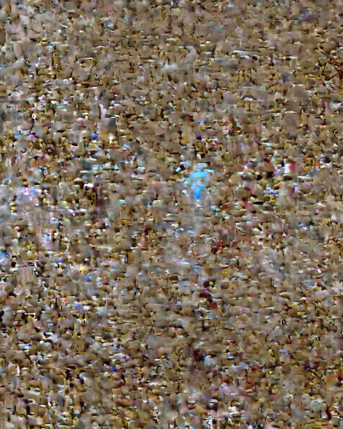 Abstract, textured background resembling chopped nuts or a dense topping for date brownies.